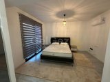 KIBRIS GİRNE OZANKÖY BÖLGESİNDE MUHTEŞEM DAĞ VE DENİZ MANZARALI,ŞÖMİNELİ VE FULL EŞYALI KİRALIK 4+1 LÜKS VİLLA