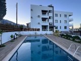 KIBRIS GİRNE ALSANCAK BÖLGESİNDE MUHTEŞEM DAĞ VE DENİZ MANZARALI ORTAK HAVUZ VE EBEVEYN BANYOSU BULUNAN FULL EŞYALI SATILIK 2+1 DAİRE
