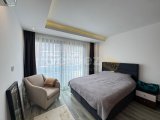 GİRNE MERKEZDE FULL EŞYALI ÜÇ YATAK ODALI SATILIK DAİRE