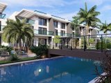 Kıbrıs İskele Long Beach Bölgesinde Bir Komplekste Satılık Bahçe Katı ve Çatı Teraslı 1+1 Daireler