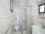 Girne'nin Merkezinde Ortak Havuzlu Bir Sitede Satılık Zemin Kat 3+1 Daire