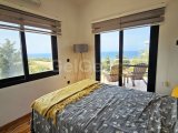 Girne, Sadrazamköy'de 950 m² arsa üzerinde, kumsallara yürüme mesafesinde, kesintisiz deniz manzaralı satılık 3+1 villa