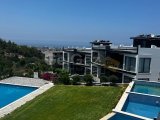 Girne , Belapais'de ortak yüzme havuzlu satılık 2+1 lüks daire