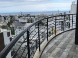 Girne merkezde deniz ve dağ manzaralı satılık 1+1 daire