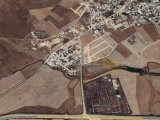 GAZİMAĞUSA/MUTLUYAKA'DA SATILIK 8 DÖNÜM 1 EVLEK TARLA