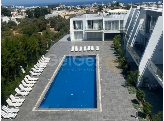 GİRNE/DOĞANKÖY'DE HAVUZLU SİTEDE SATILIK 1+1 DAİRE