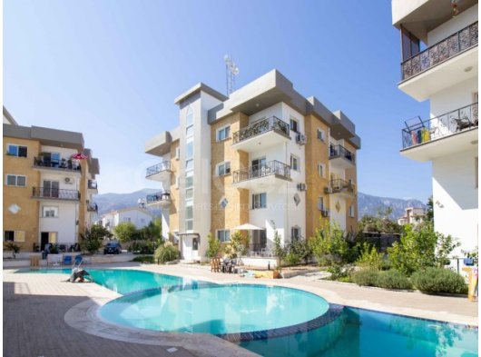 2 yatak odalı satılık daire + ortak havuz + beyaz eşya + klima + harika konum + mükemmel yatırım