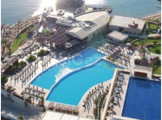 Ozanköy'ün kalbinde geniş çatı terası ve ortak havuzlu yeni inşa edilmiş 2 + 1 daire