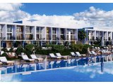 1 yatak odalı dubleks satılık daire + yüzme havuzu + spor salonu + spa + aqua park + plaja 400m + 24 saat güvenlik
