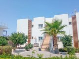 2 yatak odalı bahçeli ikinci el daire + full eşyalı + ortak havuzlar + kapılı güvenlik + Sahibi adına tapu, KDV ödenmiş