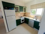 2 yatak odalı bahçeli ikinci el daire + full eşyalı + ortak havuzlar + kapılı güvenlik + Sahibi adına tapu, KDV ödenmiş