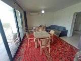 2 yatak odalı bahçeli daire + full eşyalı + depo odası + 3 ortak yüzme havuzu + amfitiyatro + okullara ve Girne şehir merkezine yakınlık