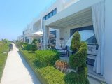 3 yatak odalı bahçe katı daire + tamamen mobilyalı + ortak havuzlar + spor salonu + sauna + yepyeni wellness merkezi + denize muhteşem manzaralı + Sahibinin adı