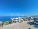 Lüks 1 yatak odalı ikinci el çatı katı daire + full eşyalı + jakuzili çatı terası + yerden ısıtma + klima + denize 100m + ortak havuzlar + deniz ve dağ manzaras