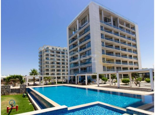 1 yatak odalı yeniden satılık tatil dairem + tamamen mobilyalı + ortak yüzme havuzları + çatı katı havuzu + spor salonu + kumsal + Pre 74 Türk tapu senedi