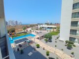 1 yatak odalı yeniden satılık tatil dairem + tamamen mobilyalı + ortak yüzme havuzları + çatı katı havuzu + spor salonu + kumsal + Pre 74 Türk tapu senedi