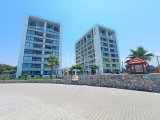 1 yatak odalı yeniden satılık tatil dairem + tamamen mobilyalı + ortak yüzme havuzları + çatı katı havuzu + spor salonu + kumsal + Pre 74 Türk tapu senedi