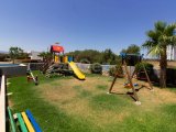 1 yatak odalı yeniden satılık tatil dairem + tamamen mobilyalı + ortak yüzme havuzları + çatı katı havuzu + spor salonu + kumsal + Pre 74 Türk tapu senedi