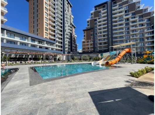 Iskele’de güvenlikli ve bakımlı sitede satılık uygun fiyatlı 1+1 daire!