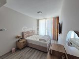 Girne merkezde karmarket civarı havuzlu rezidansta kiralık full eşyalı 2+1 daire
