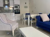 Girne zeytinlik bölgesinde full eşyalı geniş teraslı satılık 2 + 1 daire