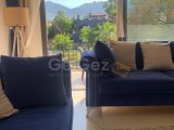 Girne zeytinlik bölgesinde full eşyalı geniş teraslı satılık 2 + 1 daire