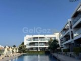 Girne Alsancak’ta Lüks Site İçerisinde Bahçeli, Krediye Uygun, Full Eşyalı Satılık 2+1 Daire