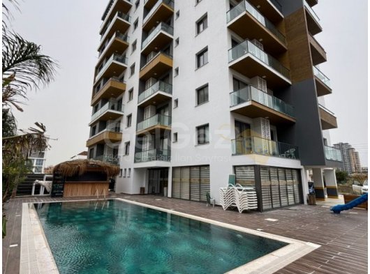 İskele Long Beach Bölgesi Homeland Sitesi'nde Havuzlu Full Eşyalı Lüks 2 +1 Satılık Daire