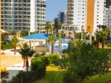 İskele, Long Beach - Caesar Resort & SPA'da Havuz Manzaralı 1+1 Full Eşyalı Daire