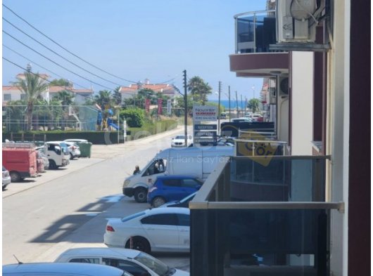 İskele Long Beach'te deniz manzaralı, eşyalı 2+1 satılık daire.