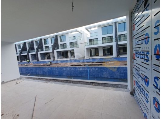 2+1 daire, havuz manzaralı, zemin katta bulunan – KDV, TRAFO ödenmiş Elysium Projesi’nde