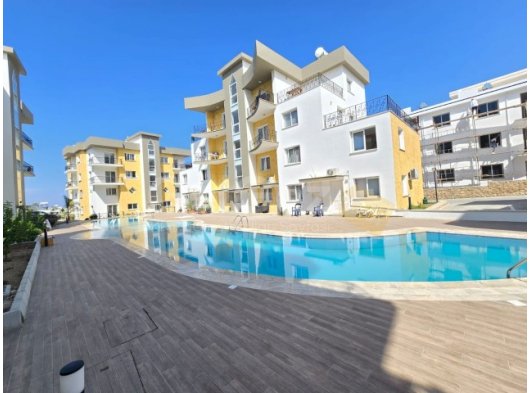 Girne Alsancak'ta Merit Otellere Yakın Havuzlu Site İçinde Takasa Uygun 1+1 Satılık Daire