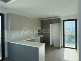 Girne'nin tam merkezinde, denize yürüme mesafesinde yer alan yeni apartman binasında satılık sıfır 3+1 daire!