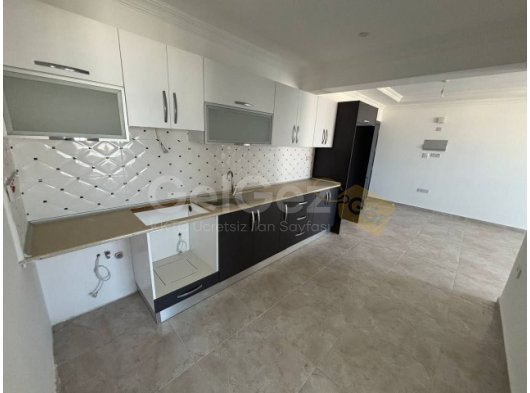 Alsancak'ta Yüksek Kira Getirili Sitede Deniz Manzaralı Satılık 2+1 Daireler