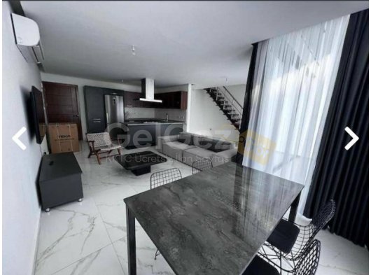 Girne Merkez'de Muhteşem Konum'da Eşyalı Kiracılı Satılık Loft 2+1 Daire