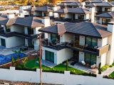 KIBRIS GİRNE EDREMİT BÖLGESİNDE ÖDEMEYE ARACINZI DAHİL EDEBİLECEĞİNİZ ÖZEL ÖDEME PLANIYLA 4+2 SATILIK VİLLA