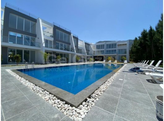 Girne'nin Doğanköy bölgesinde havuzlu sitede satılık 2+1 daire