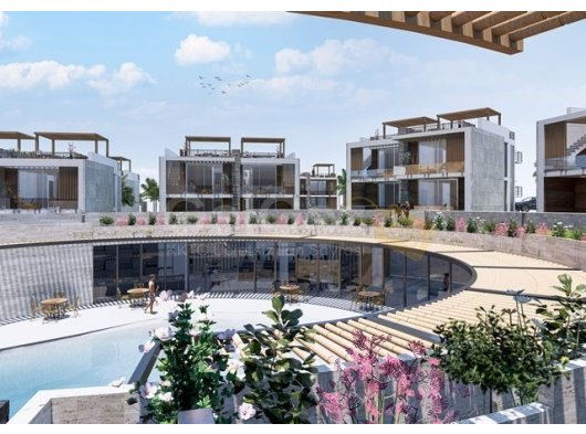 315.000 £ + KDV. Tesis Bünyesinde Olanaklara Sahip, Deniz Kenarında Bir Kaçış Noktası. Bahçeli'de İsteğe Bağlı Havuzlu, Yepyeni 2 Yatak Odalı Şehir Evleri.