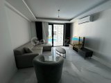Long Beach, Elysium'da kiralık 2+1 yeni daire. Terastan havuz çıkışlı. Aidat dahil 750 GBP