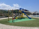 Satılık - Palm Bay Manzaralı, Bahçeli | Modern 1+1 Daire | £99,500 (Tapu Hazır!)