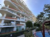 Girne'de Eşyalı 2+1 Daire, Özel Havuz ve Şehir Manzarası ile Satılık!